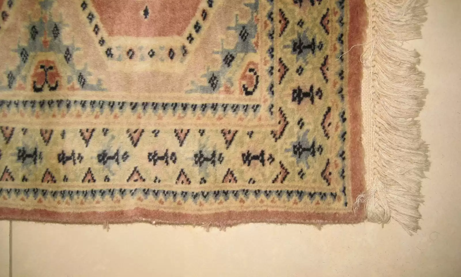 After repair: Oriental rug with seamlessly restored rip.
