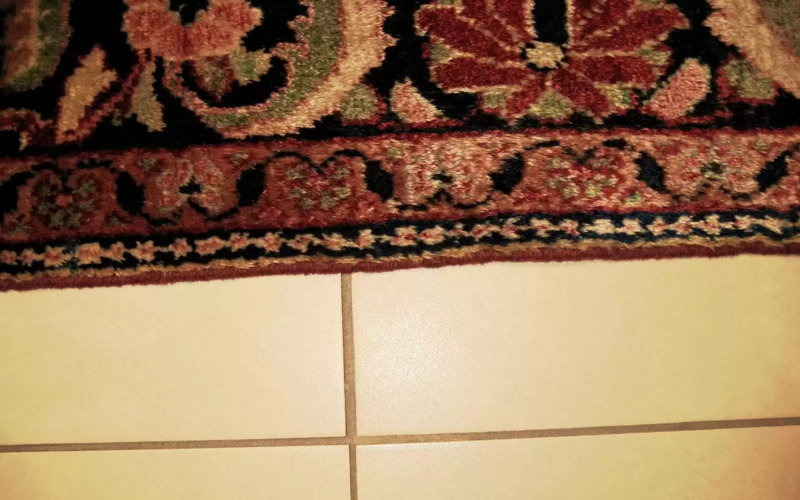 Carpet edge fully repaired and re-secured, like new.