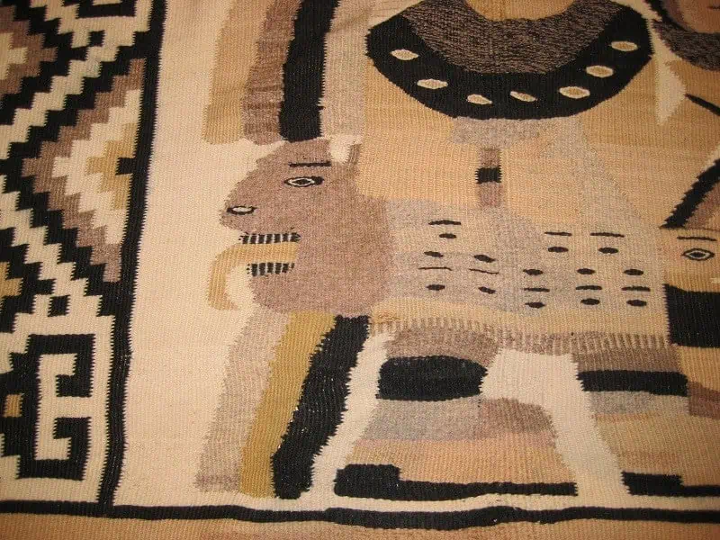 Restored Mexican Kilim rug showing vibrant colors and mended areas after professional repair.