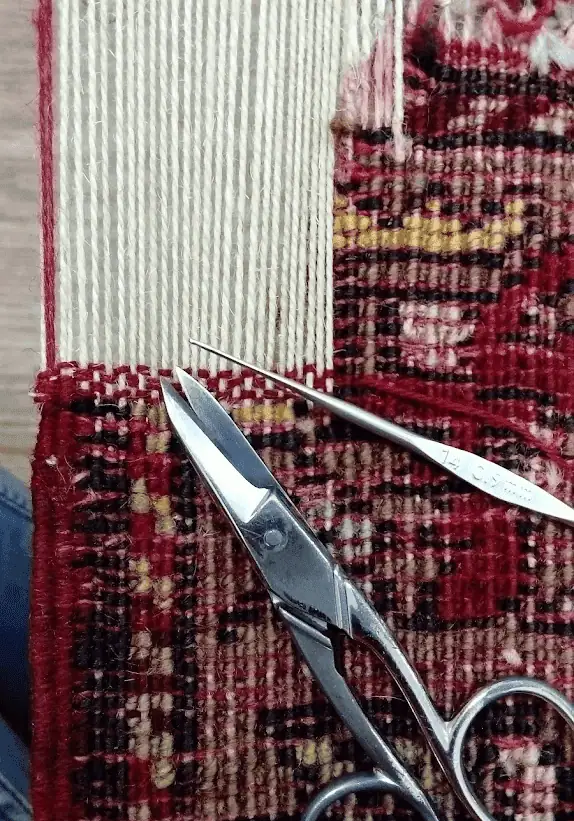 Restoration of Oriental carpet in progress