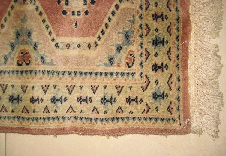 Fully repaired and revitalized hand-knotted oriental carpet, returned to its original integrity and beauty.