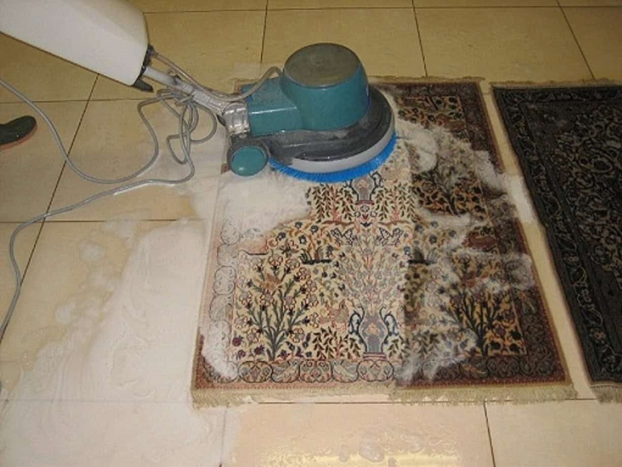 Professional carpet cleaning of a colorful oriental rug by a skilled technician