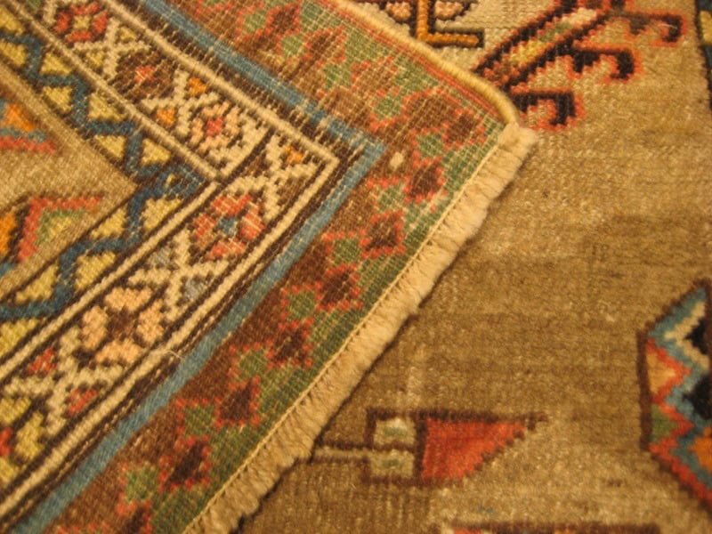 Rug with neatly re-attached and even fringes after expert restoration.