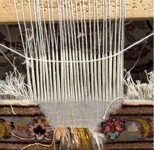 Persian rug: repair process of a hole Repair of hole in Persian rug in progress